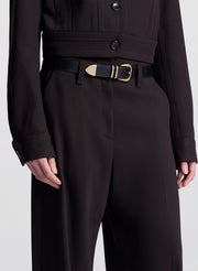 woman wearing dark brown jacket with matching dark brown pants