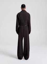 woman wearing dark brown jacket with matching dark brown pants