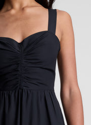 woman wearing black midi dress