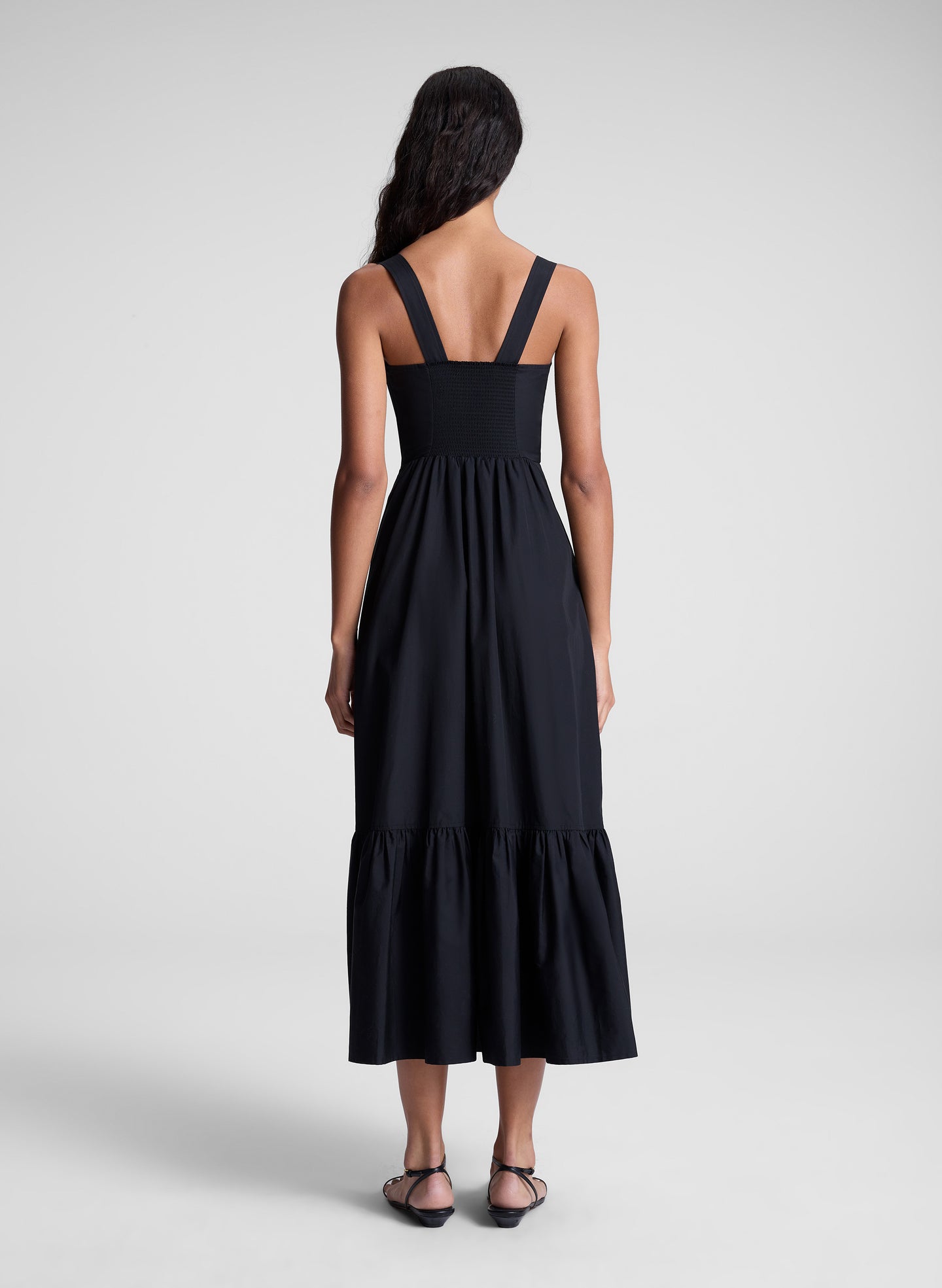 woman wearing black midi dress