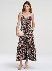 woman wearing brown print midi dress