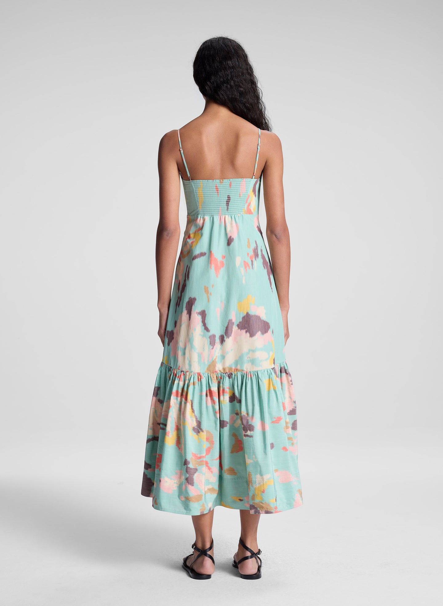 woman wearing multicolored sleeveless midi dress