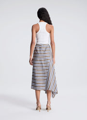 woman wearing white fine gauge tank top and striped midi skirt