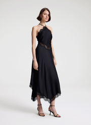woman wearing black satin and lace midi dress