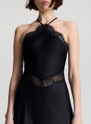 woman wearing black satin and lace midi dress