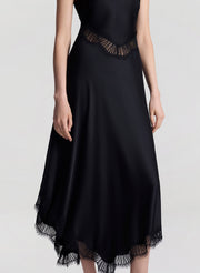 woman wearing black satin and lace midi dress