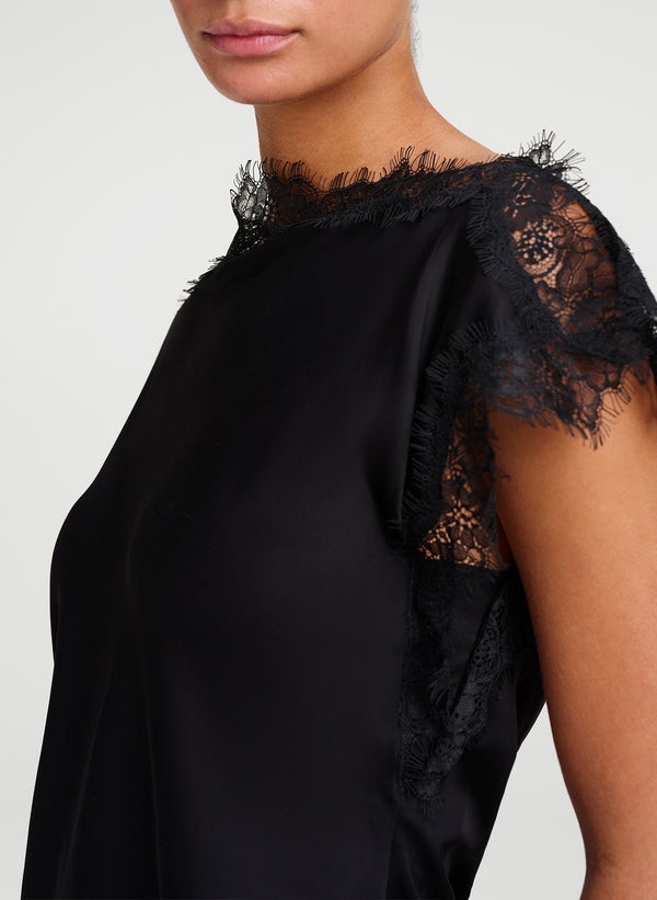 woman wearing black satin and lace top