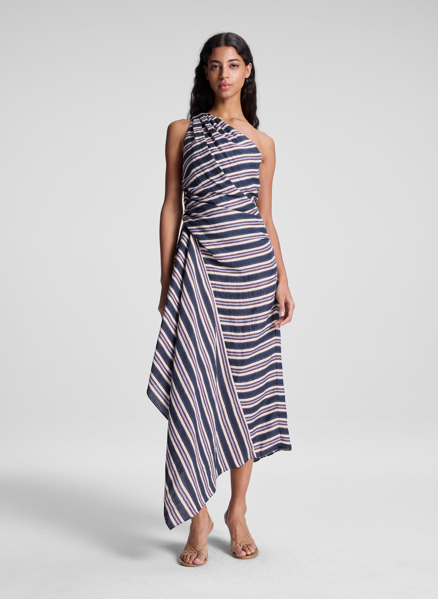 woman wearing navy blue striped midi dress