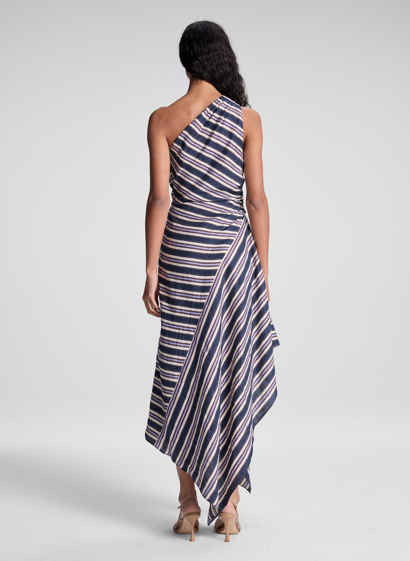 woman wearing navy blue striped midi dress
