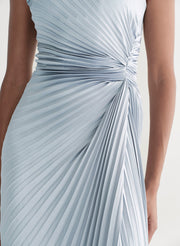Light blue pleated dress on a neutral background