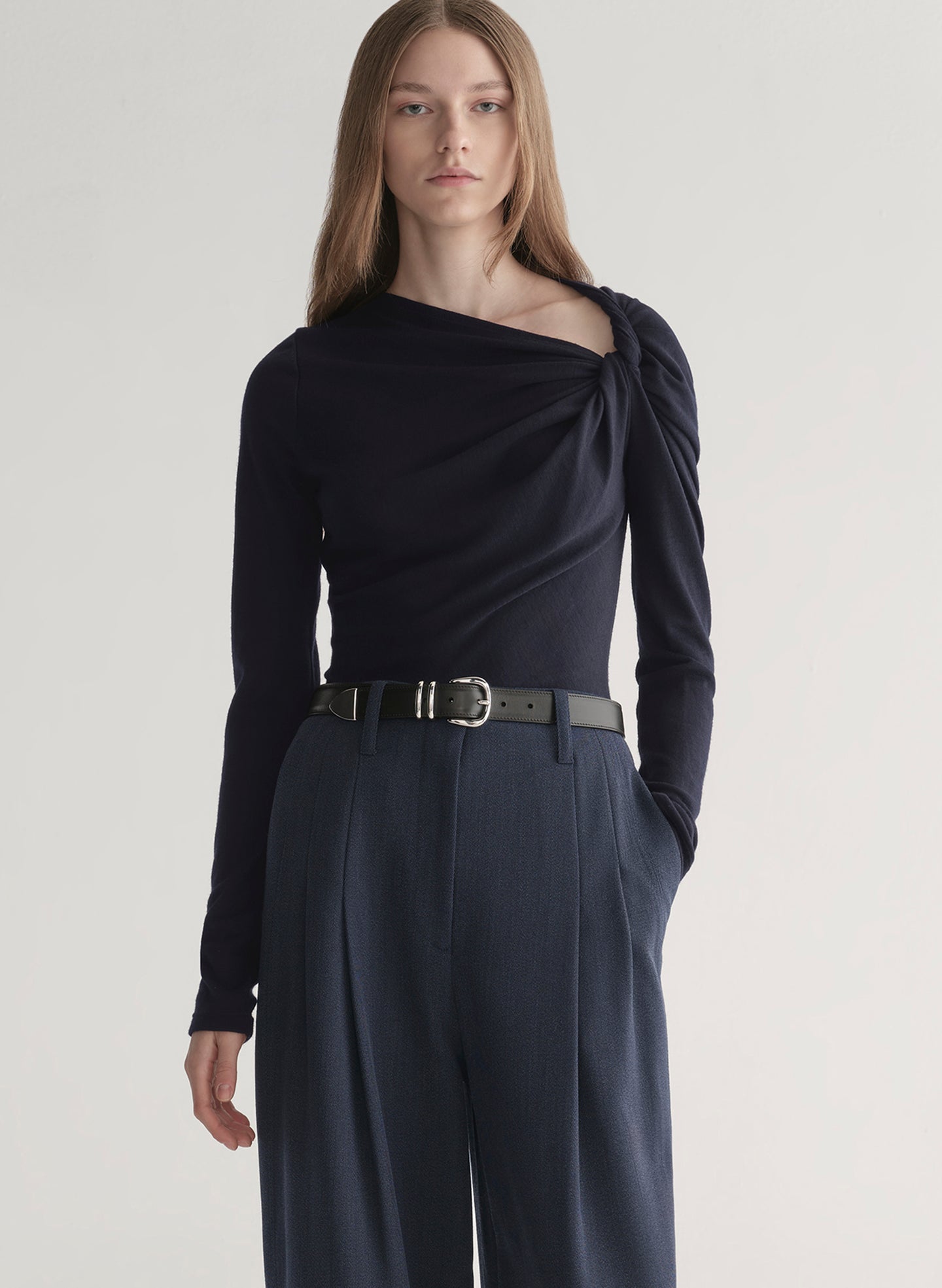 woman wearing navy blue top and navy blue pants