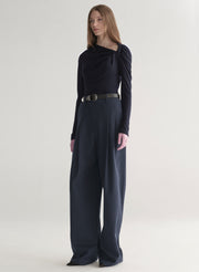 woman wearing navy blue top and navy blue pants