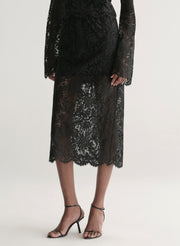 woman wearing black lace top and black lace skirt