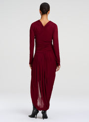 woman wearing burgundy draped dress