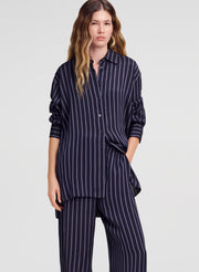 woman wearing striped top and matching pant