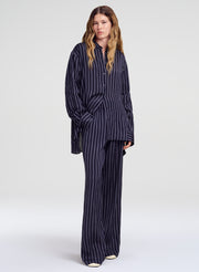 woman wearing blue striped outfit