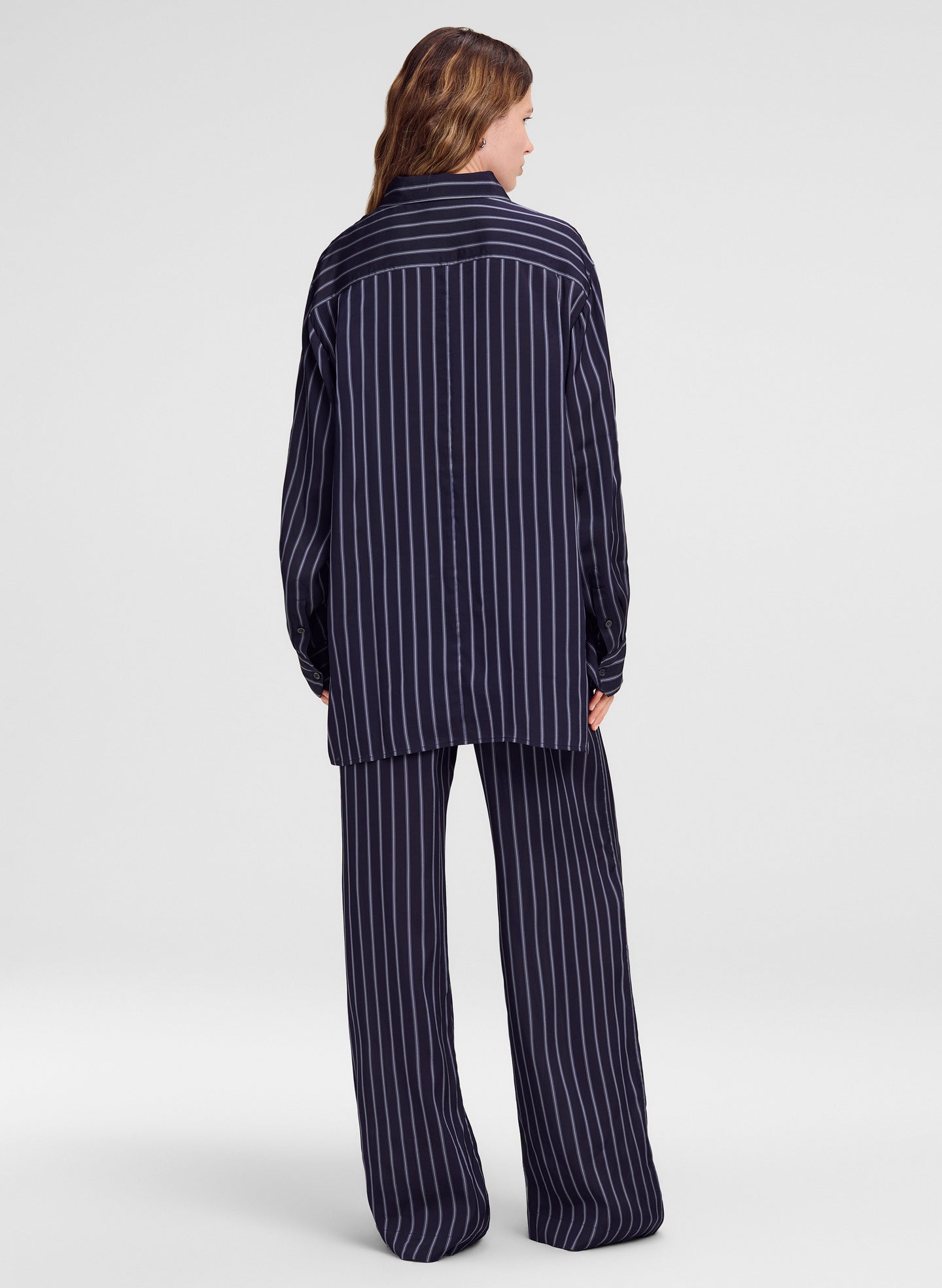 woman wearing blue striped top and matching pants