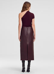 burgundy leather midi skirt and one shoulder top on model