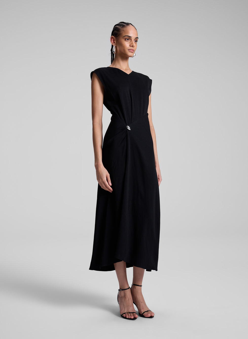 woman wearing black midi dress