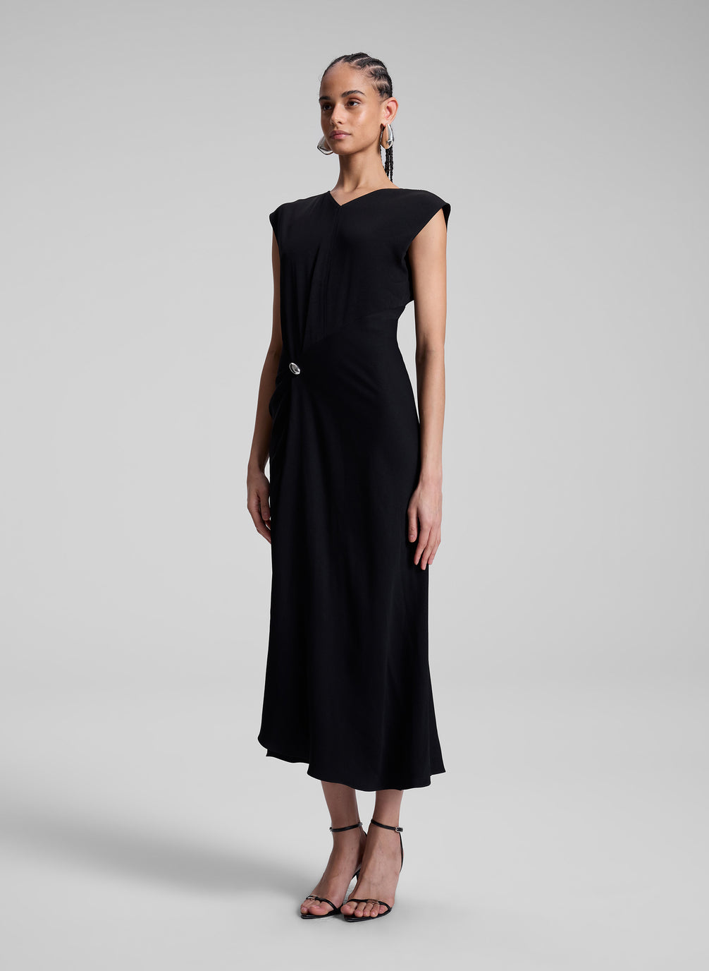 woman wearing black midi dress