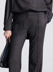 woman wearing textured brown top and matching pants