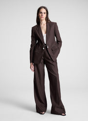 woman wearing dark brown embellished blazer and matching pant