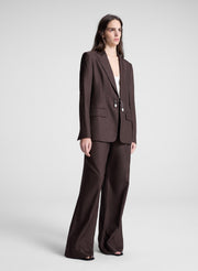 woman wearing dark brown embellished blazer and matching pant