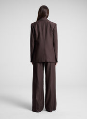 woman wearing dark brown embellished blazer and matching pant