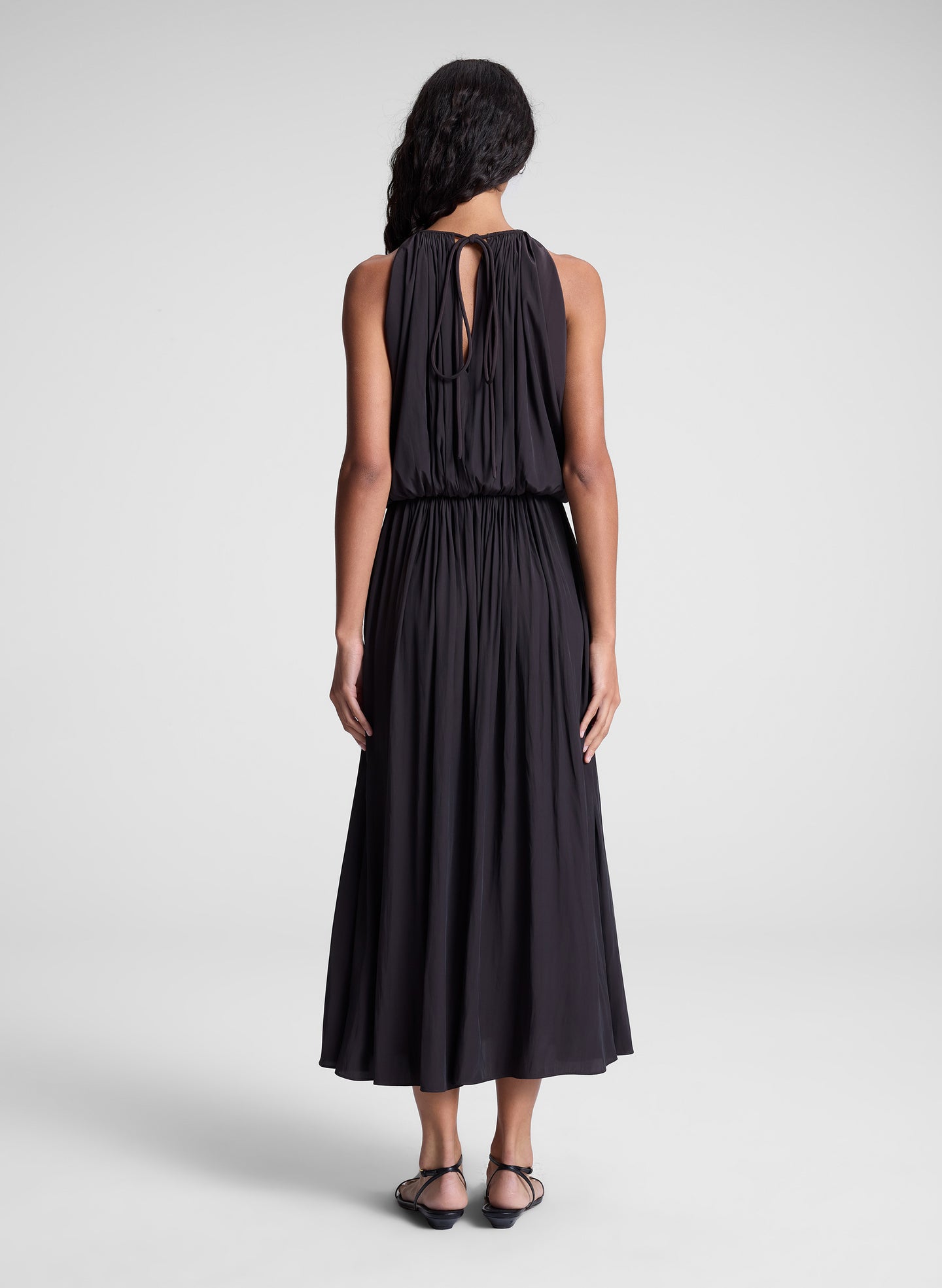 woman wearing dark brown midi dress