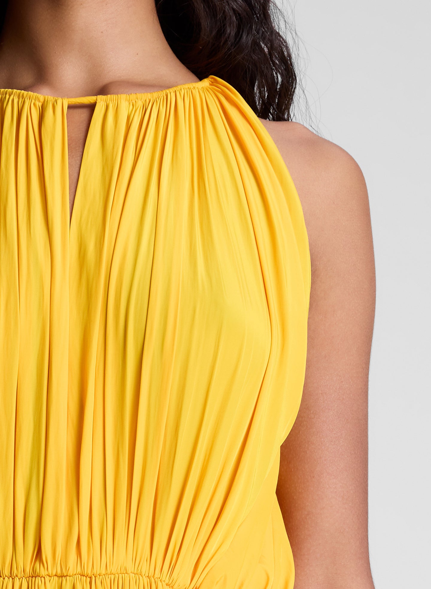 woman wearing orange midi dress