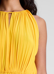 woman wearing orange midi dress