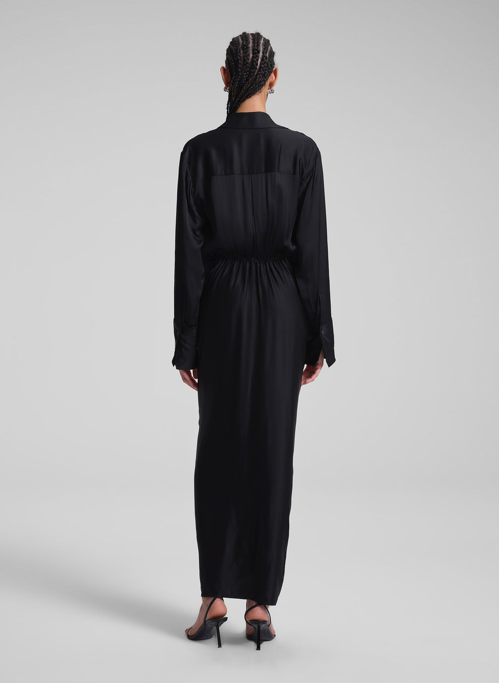 woman wearing black maxi shirt dress