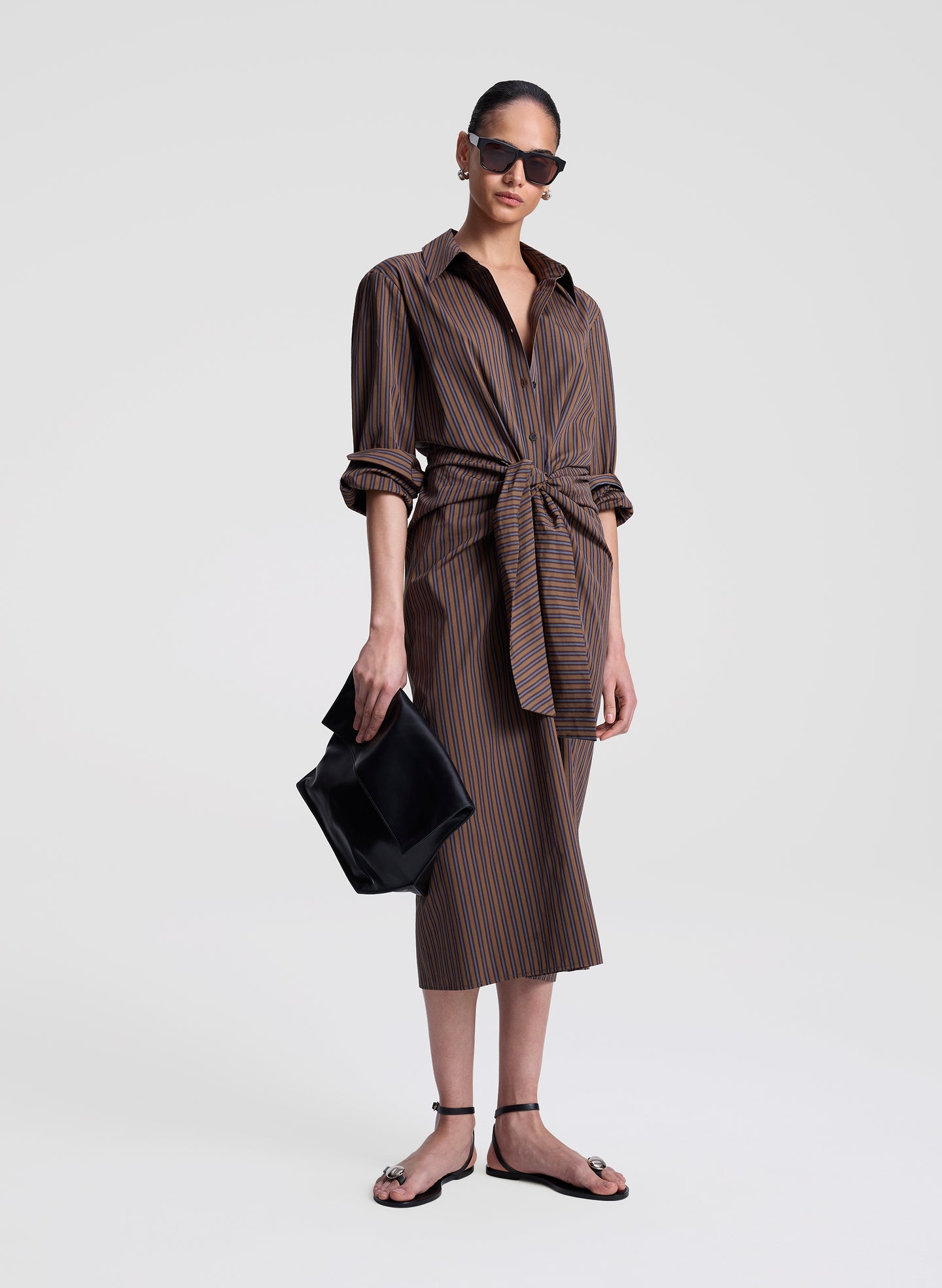 woman wearing brown striped midi shirtdress