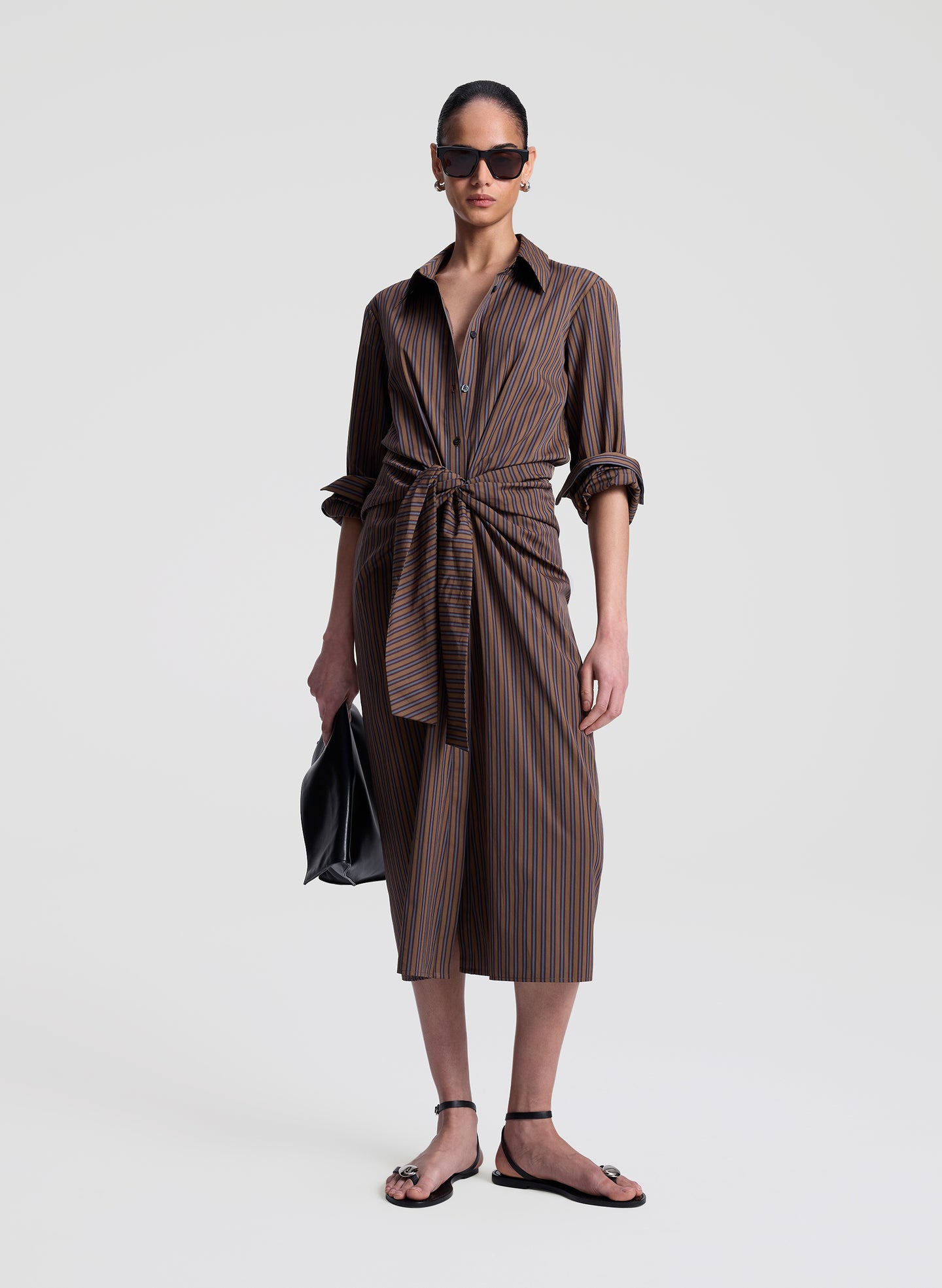 woman wearing brown striped midi shirtdress