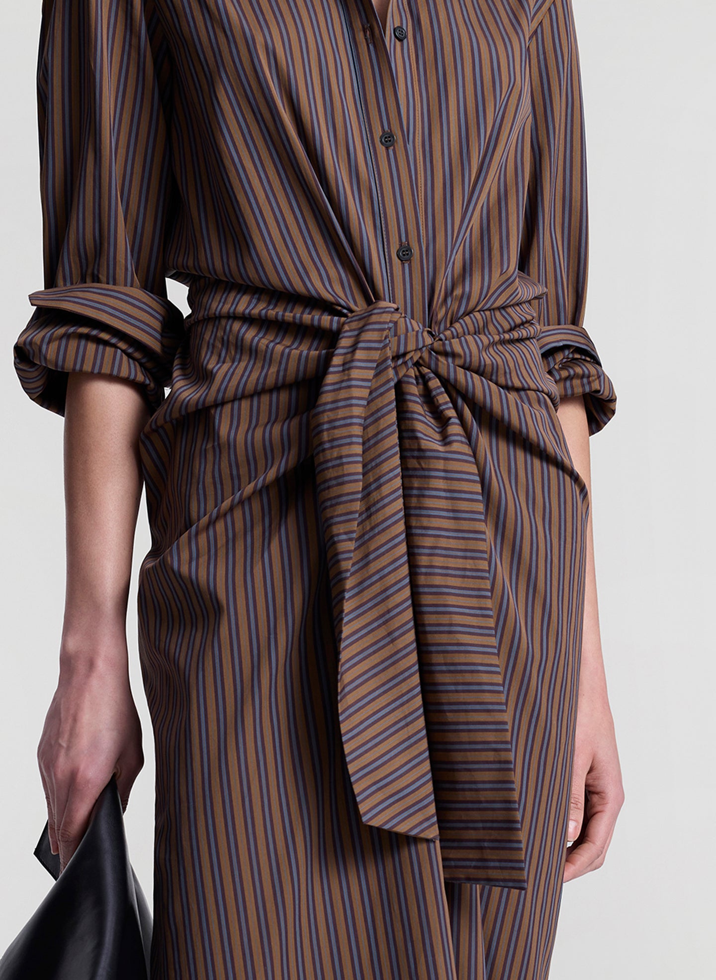 woman wearing brown striped midi shirtdress