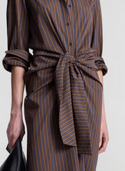woman wearing brown striped midi shirtdress