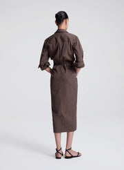 woman wearing brown striped midi shirtdress