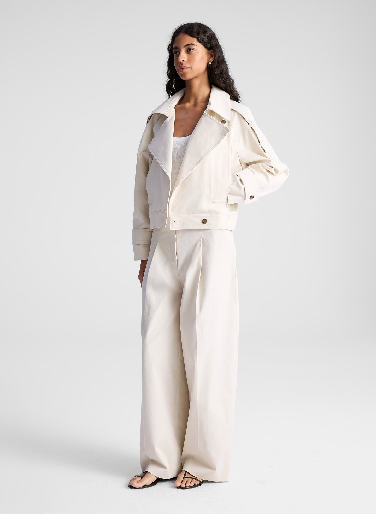 woman wearing beige jacket and matching wide leg pants