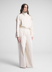 woman wearing beige pant and jacket set