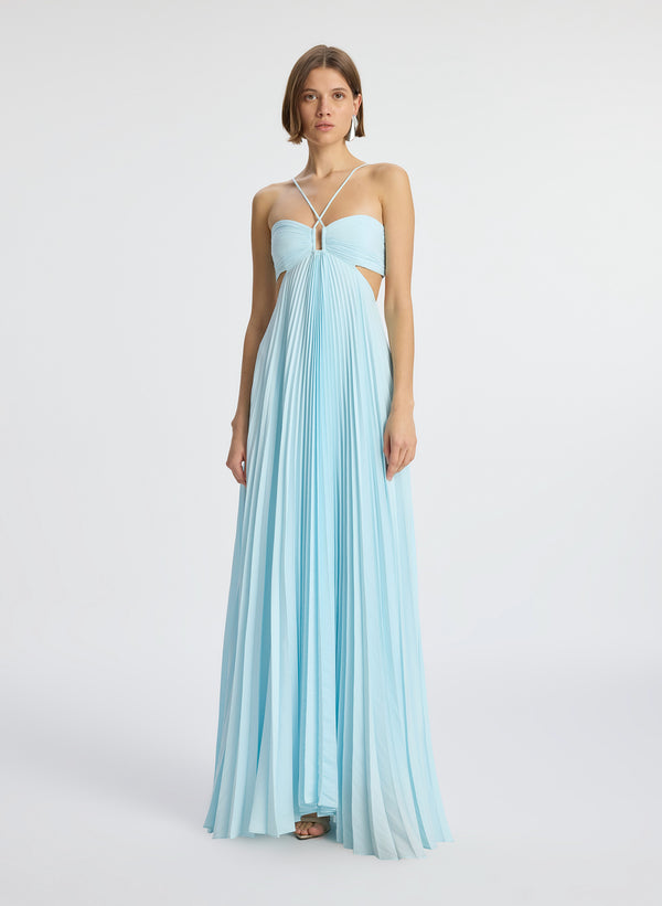 front view of woman wearing aqua satin pleated gown