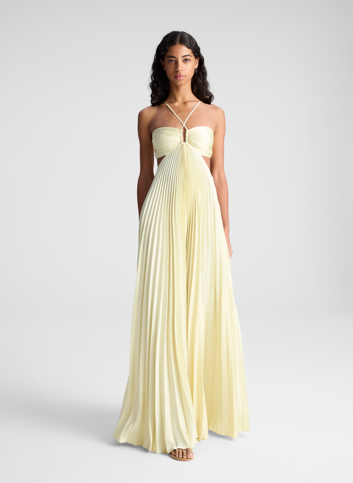 woman wearing light yellow maxi dress