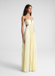woman wearing light yellow maxi dress