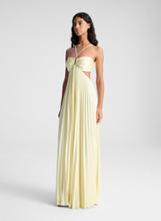 woman wearing light yellow maxi dress