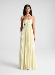 woman wearing light yellow maxi dress