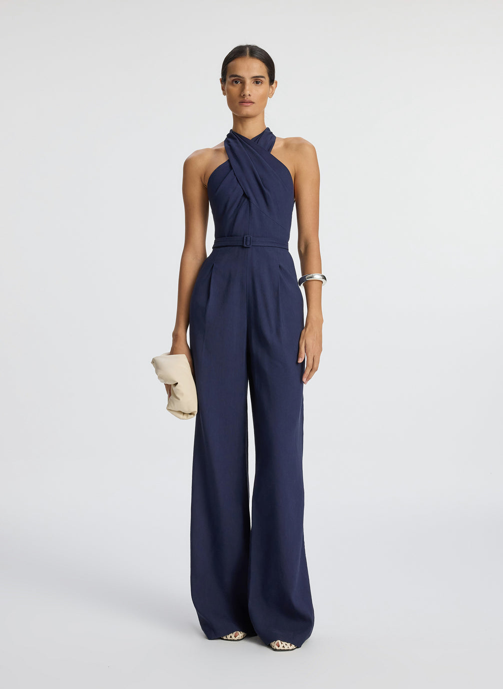 front view of woman wearing navy blue sleeveless jumpsuit