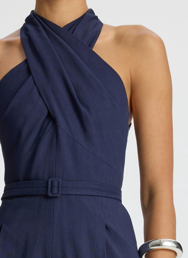 detail view of woman wearing navy blue sleeveless jumpsuit