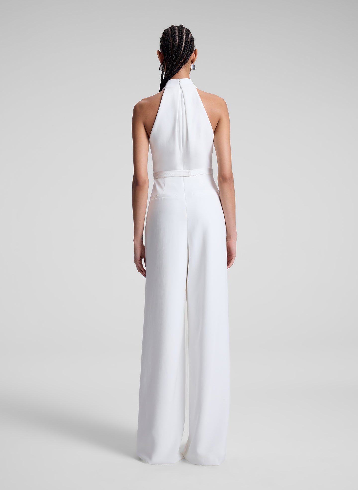 woman wearing white jumpsuit