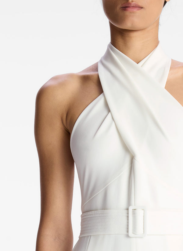 detail view of woman in white sleeveless wide leg jumpsuit