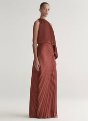 woman wearing maroon satin pleated one shoulder top and matching maxi skirt