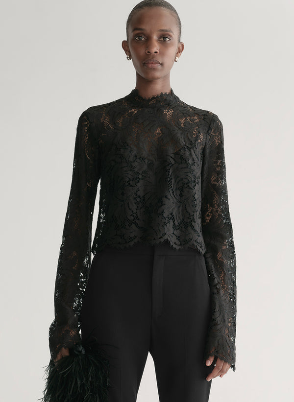 woman wearing black lace top with black pants